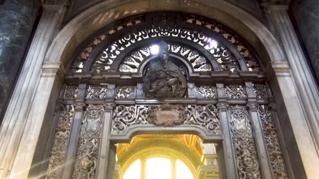 Monumental gilded brass gate made in 1665 in the Royal Chapel of the Treasure of St. Januarius inside the Naples Cathedral., Italy