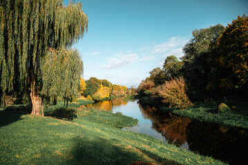 Golden autumn landscape with reflection in the river, Brest Fortress