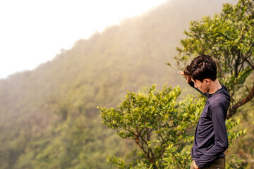 Adventurous Man Enjoying Scenic Mountain View. Scenic View from Mountain Peak.