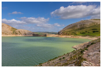 Scenic Beauty of Kasseb Dam: A Majestic View of Mountains and Lake in Bousalem, Beja, Tunisia,...