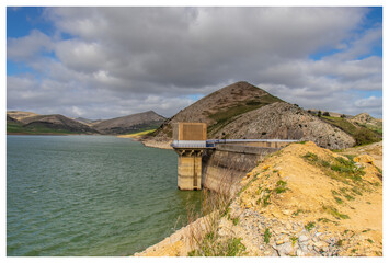 Scenic Beauty of Kasseb Dam: A Majestic View of Mountains and Lake in Bousalem, Beja, Tunisia,...