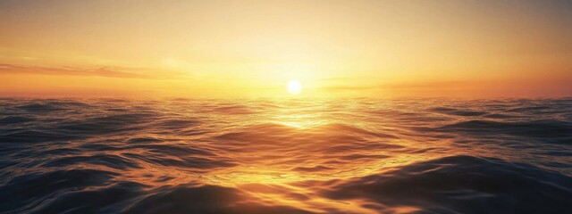 Fototapeta premium A stunning panoramic image of a golden sunrise casting warm light over a calm ocean, with subtle waves and a clear horizon