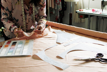 Lady in fashion studio with fabric