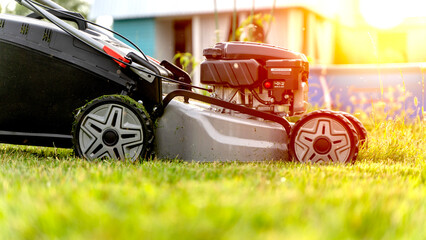lawn mower on a fresh lawn on a sunny day
