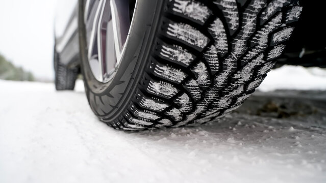 winter car tire on snow and tread in snow