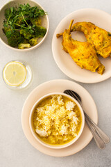 Stewed rabbit with rice, broccoli , served table with food, delicious hearty lunch or dinner