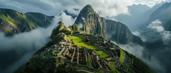 Majestic aerial view of Machu Picchu, set against lush green mountains and misty clouds, showcasing the ancient Incan ruins and breathtaking natural beauty. - Powered by Adobe