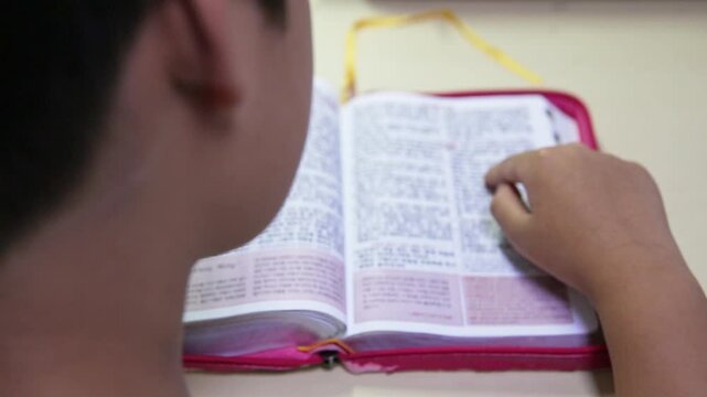 The Back of a Child Reading a Bible, South Korea