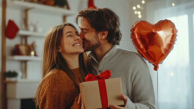 Lovely couple with gift box at home room in holiday season.