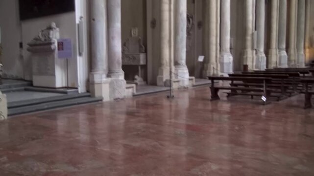 View of the colonnade and chapels under the arcades inside the Basilica of San Lorenzo Maggiore, Naples, Italy. 