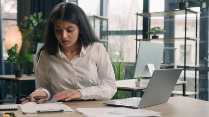 Multiracial student girl studying online serious busy businesswoman in office writing notes ideas...