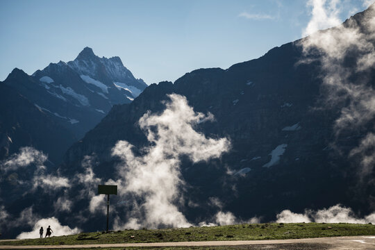 View of majestic Bernese Alps with rugged peaks and serene clouds, Wengen, Switzerland.