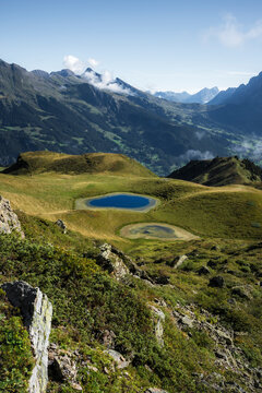 View of serene lake and majestic mountains in the Bernese Oberland, Wengen, Switzerland.