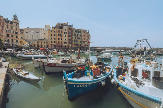 Camogli, Italy - 21 July 2021: View of camogli harbour with colorful buildings and fishing boats, camogli, italy.
