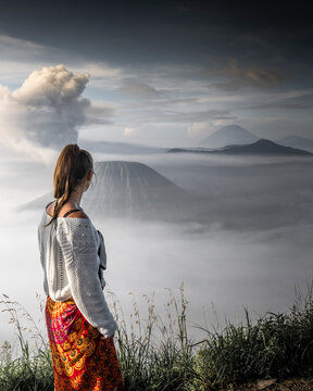 View of majestic Mt Bromo surrounded by fog and clouds at dawn, East Java, Indonesia.