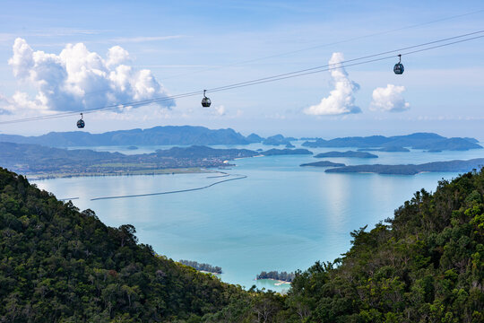View of breathtaking cable car ride over tropical islands and serene ocean, Langkawi, Malaysia.