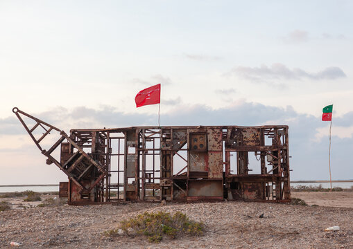 Remainings of a truck destroyed during the civil war with islam flags, Awdal region, Zeila, Somaliland