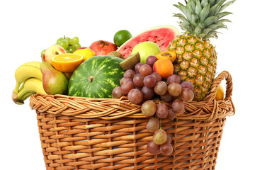 Many different fresh fruits in wicker basket isolated on white