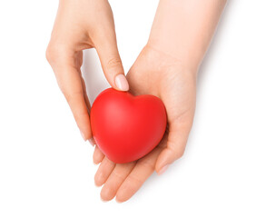 Woman with red decorative heart at white table, top view