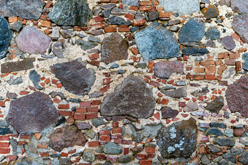 Colorful stone and brick wall texture showcasing natural materials in a rustic setting