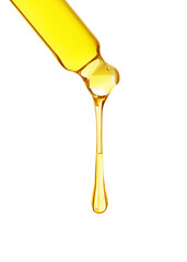 Essential oil dripping from pipette on white background
