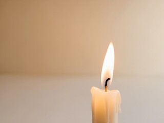 A Single Candle Burning Brightly in a Warm Atmosphere.