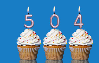 Birthday Cupcakes With Candles Lit Forming The Number 504