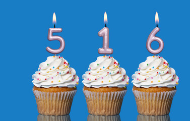 Birthday Cupcakes With Candles Lit Forming The Number 516