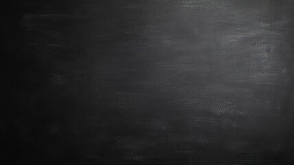 Obraz premium Textured black chalkboard surface with subtle variations, ideal for backgrounds.