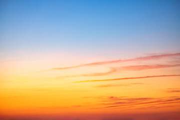 Fototapeta premium Beautiful , luxury soft gradient orange gold clouds and sunlight on the blue sky perfect for the background, take in everning,Twilight, Large size, high definition landscape photo