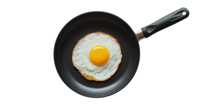 Fried egg in a black non-stick frying pan isolated on transparent background - Powered by Adobe