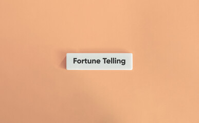 Fortune Telling. Text on Block Letter Tiles on Dusty Pink Background. Minimal Aesthetic.