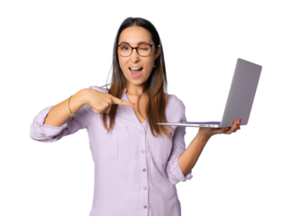 Portrait of cheerful young woman standing isolated over transparent background using laptop computer. Looking camera.
