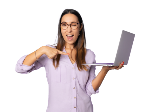 Portrait of cheerful young woman standing isolated over transparent background using laptop computer. Looking camera.