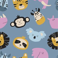 Fototapeta premium Hand drawn pattern with African animals. Seamless illustration for textile, fabric and stationery design. Faces of safari wild animals.