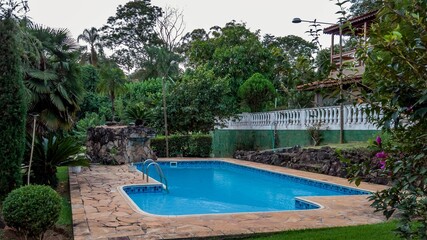 Serene swimming pool in tropical garden