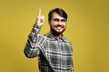 man smiling and pointing up