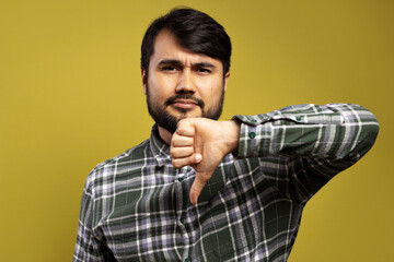 Fototapeta premium serious man with thumbs down as a sign of disapproval