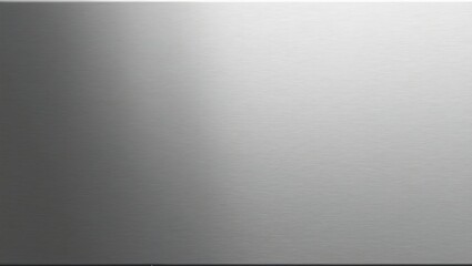 Brushed stainless steel close up with soft matte finish and subtle horizontal lines reflecting light