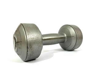 A single dumbbell of 4,4 lbs or 2 kilograms with shiny silver chromatic color made from sand for fitness isolated on white background