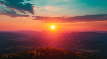 Fototapeta premium Stunning sunrise over the mountains with vibrant colors filling the sky.