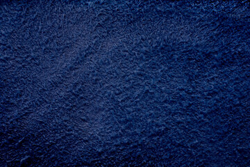 Dark blue closeup suede background 