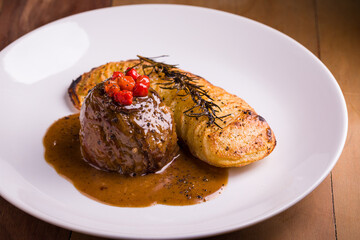 Gourmet Beef Dish with Grilled Potatoes and Rosemary Garnish