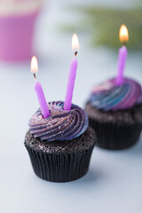 Vibrant Galaxy Cupcakes With Purple Candles and Swirls