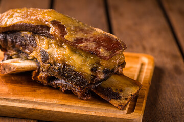 Juicy Roasted Beef Rib on Rustic Wooden Cutting Board