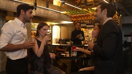 Man with couple standing fronted bar while friend walking to cheers cocktail in Paloma, Margarita, Old fashioned and Martini while bartender making special party beverage vibrant nightclub. Vinosity.