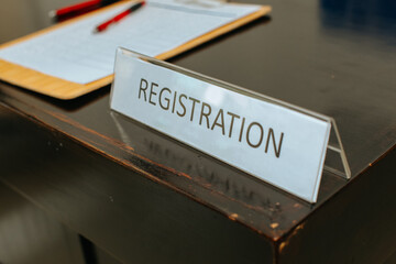 registration desk in front of conference, selective focus