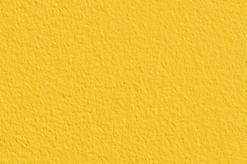Yellow concrete wall texture background. Uneven render stucco painted concrete wall texture background. Rough and grunge wall.