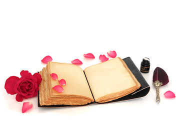 Valentines Day love letter with rose flower, petals, aged notebook, quill pen and ink on white background. Romantic love concept for Valentine card.