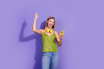 Photo of crazy carefree cute woman wear stylish sequins clothes buy new gadget isolated on purple color background